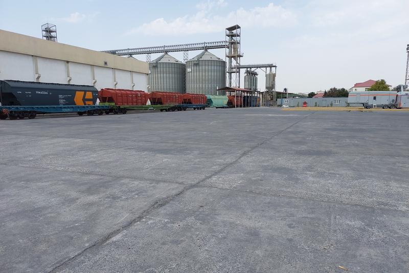 Grain silos and rail wagons at a terminal