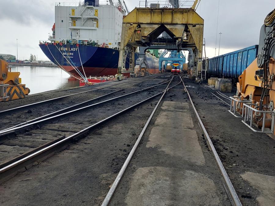 Railway tracks leading to a ship being loaded